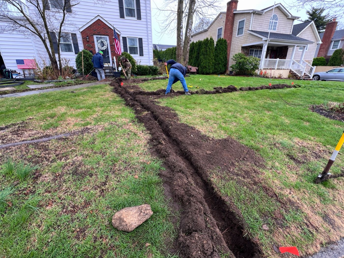 Our crew trenching for a new lawn sprinkler system installation in Eastchester, NY